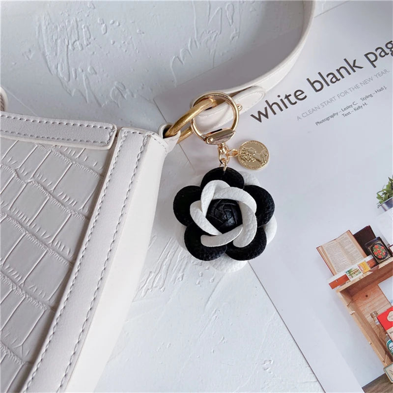 Luxury Black White Camellia Genuine Leather Flower Keychain Letter Umbrella Pendant Car Key Chain Ring Pendant For Bag Accessory